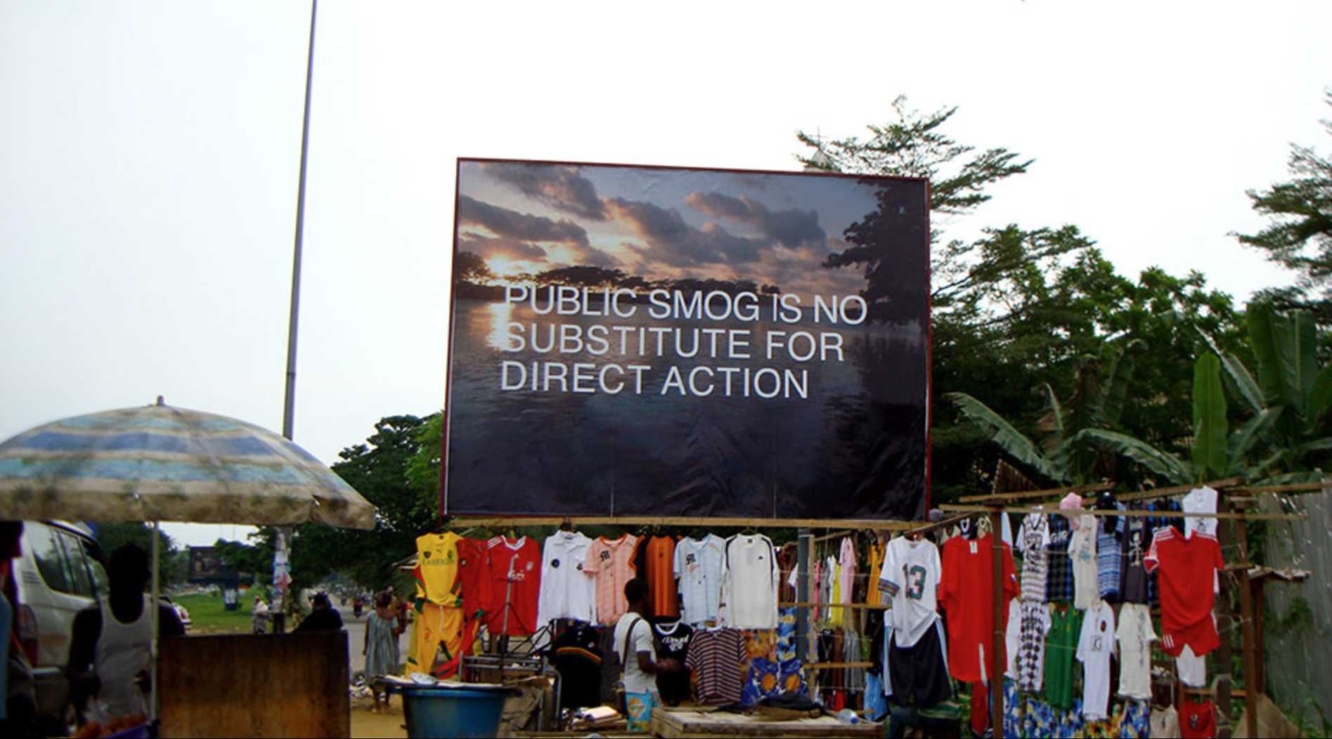 Amy Balkin, "Public smog is no substitute for direct action", Bonamoussadi, Douala, 2009, Billboard. Photo: Benoît Mangin, Courtesy the artist.