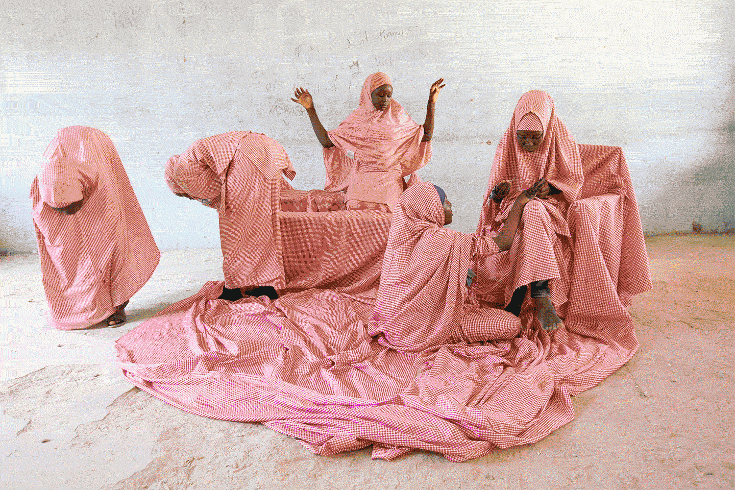 	[1] Rahima Gambo, Doing Lalle in a classroom, 2019. From the series “Tatsuniya II.” Courtesy of the artist. [2] Niklas Lichti, Concrete Quarterly (still), 2020. Courtesy of the artist and Galerie Emanuel Layr, Vienna. [3] Henry Joseph Darger, Untitled, unknown date, Courtesy Karin and Gerhard Dammann, Switzerland. [4] Laila Bachtiar, Ein Wolf [A Wolf], 2016. Courtesy of Hannah Rieger Collection. © gallery gugging. [5] Yesmine Ben Khelil, Tout devient rose ... 3 (Everything Becomes Pink ... 3), 2020. Courtesy of the artist and Galerie Maïa Muller, Paris. [6] Tony Cokes, Testament A: MF FKA K-P X KE RIP (still), 2019. Courtesy of the artist, Greene Naftali, New York, Hannah Hoffman, Los Angeles, and Electronic Arts Intermix, New York.