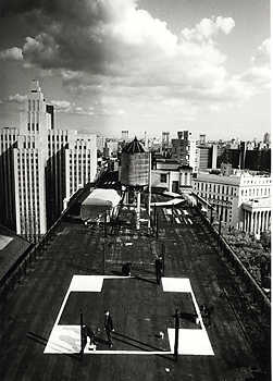 “"Transcentrala New York, Moscow, Ljubljana," 1992–1997. "Cross (New York)". Black and white photograph by Leslie Fratkin. Courtesy the artists and Galerija Gregor Podnar Berlin/Ljubljana.