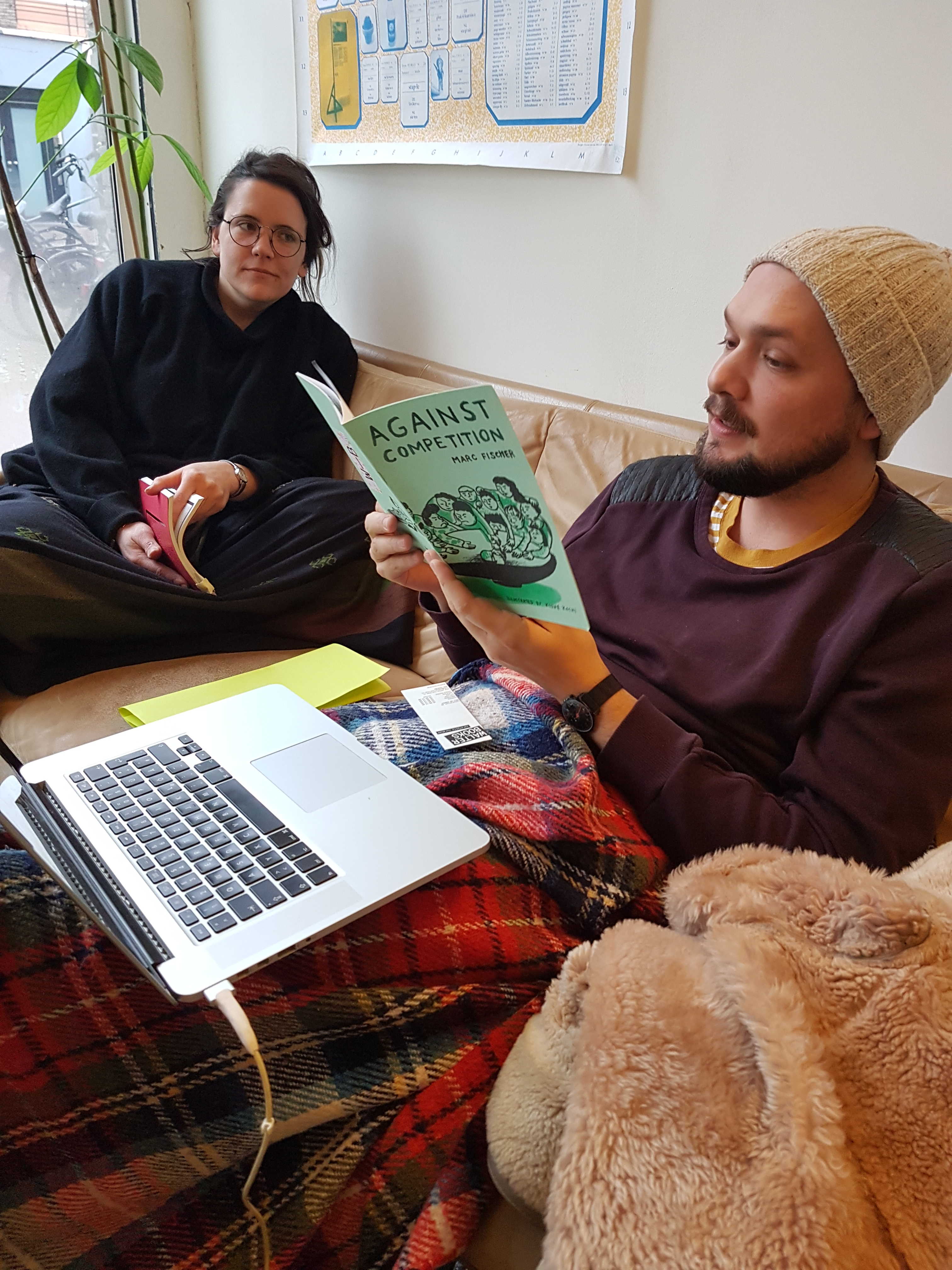 DAI Week 7 March 2018 @ WALTER books: student Leon Filter reads a text to student Olga Micinska. (Photo: Rik Fernhout)