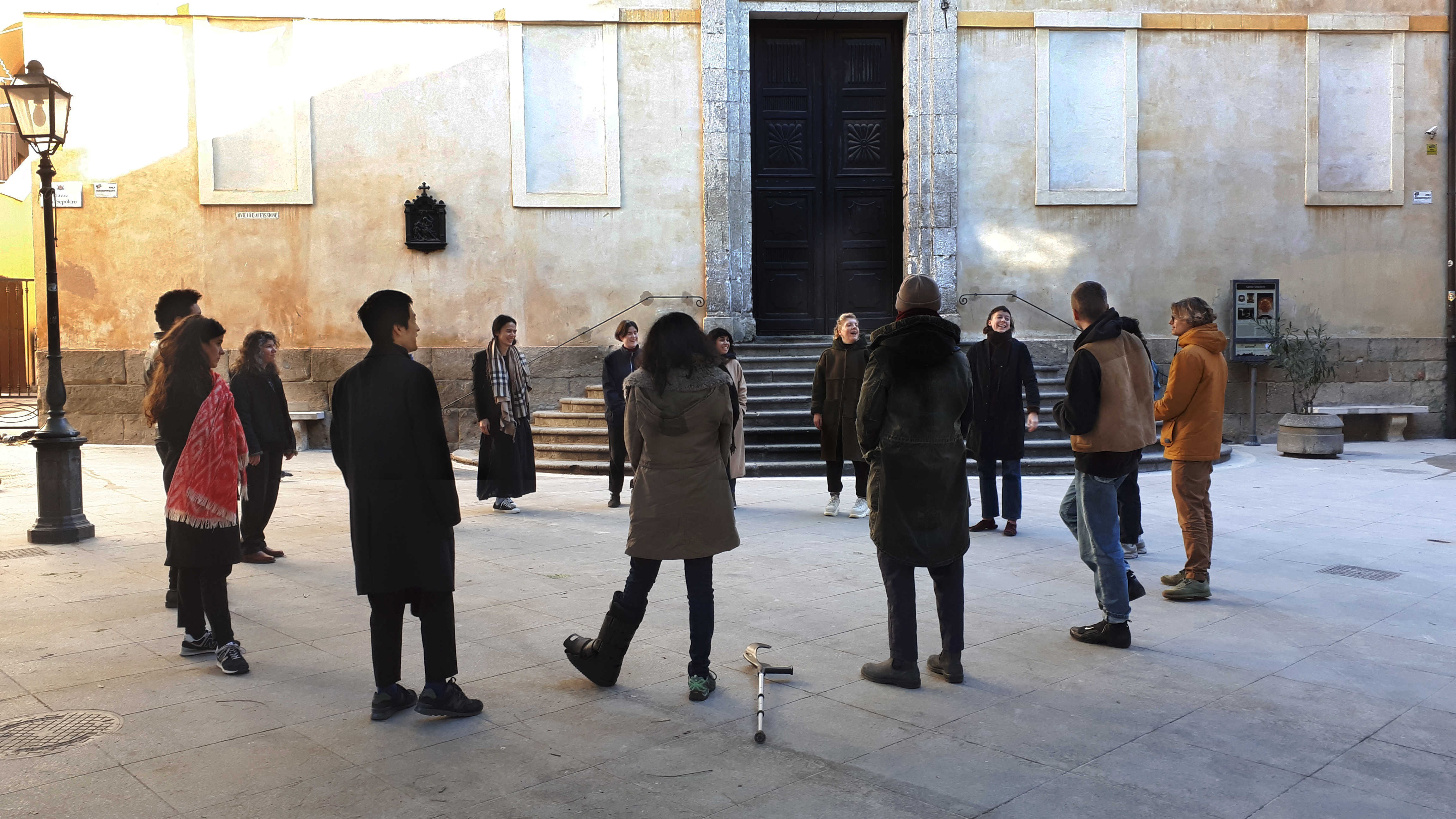 Justice Economy Factory Workshop group performing collective body exercises in public space, Cagliari January 2019. Photo credits: Nikos Doulos