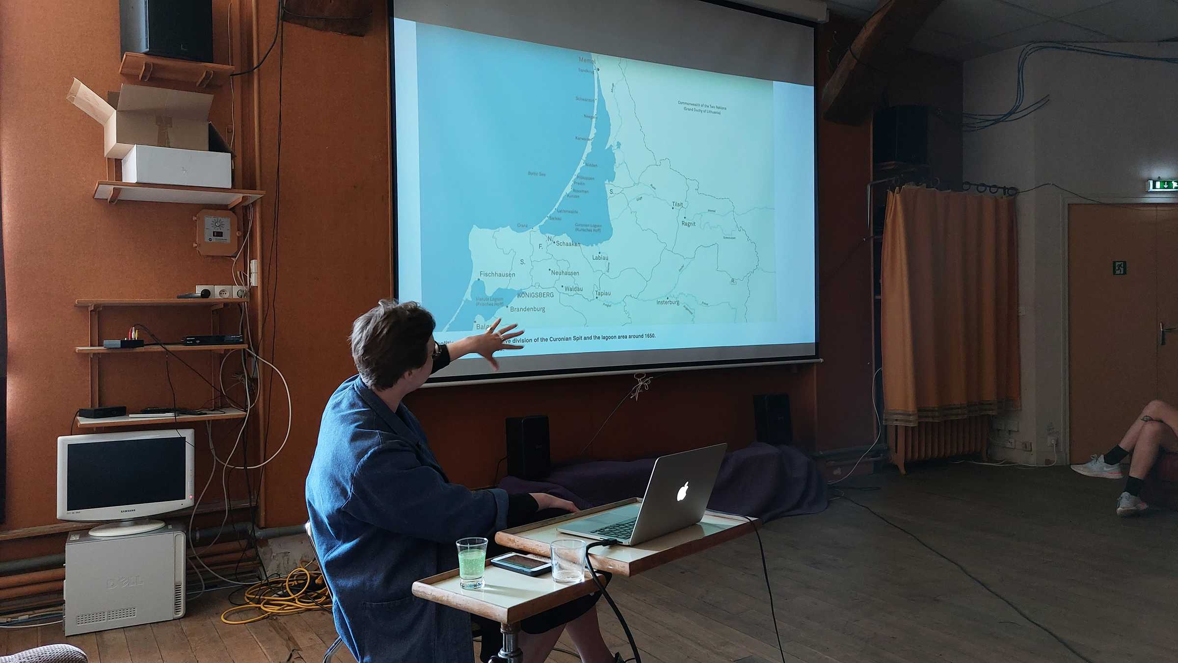  Egija Inzule introducing us to the Curonian Spit and the artistic research activities intiated by the NAC. June 7th 2021 @PAF. Photo credits: Nikos Doulos
