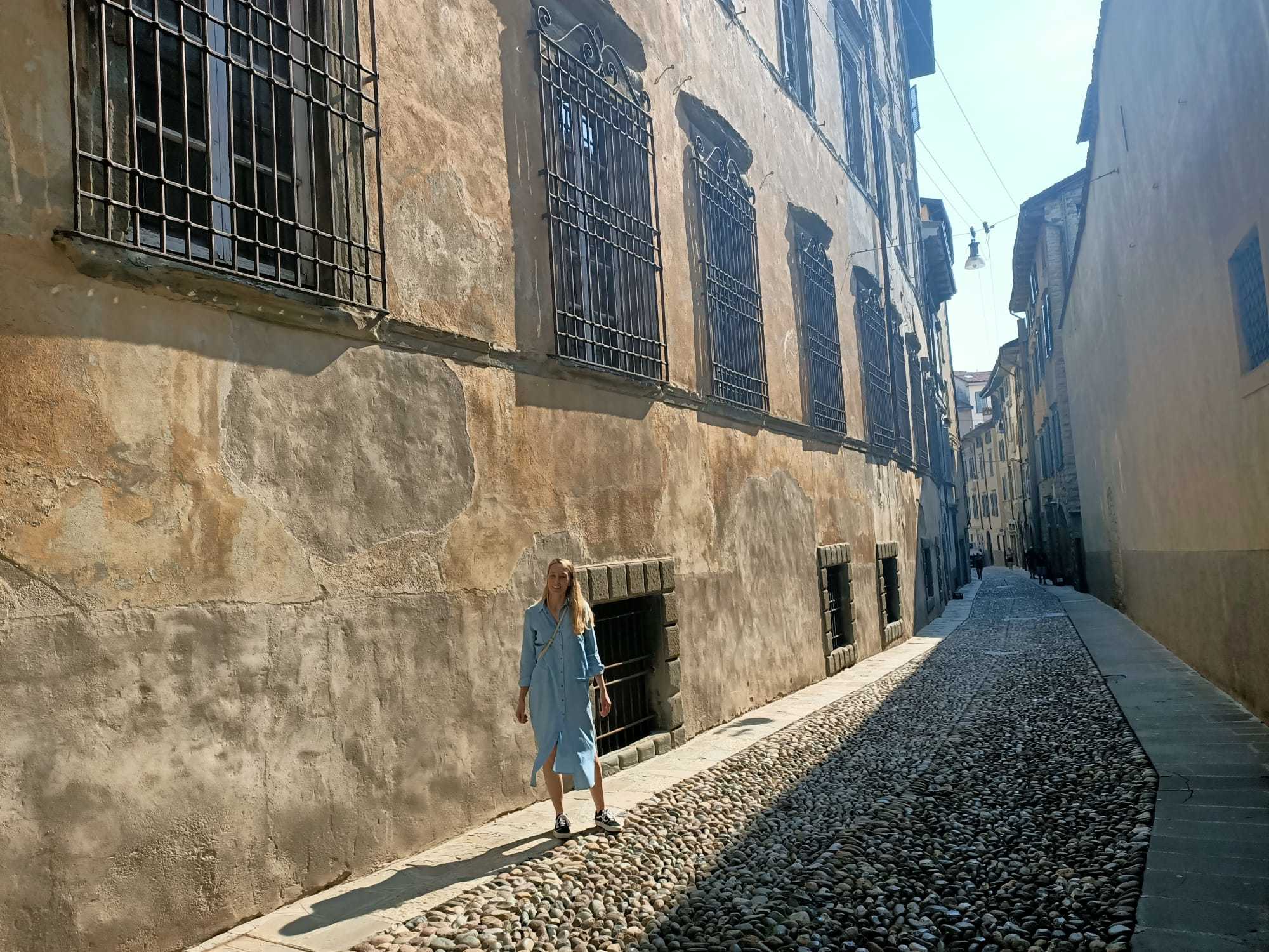 Sara Benaglia in front of one of the walls of Domus Magna, where Base Arte Contemporanea Odierna is located. Photo: Gabriëlle Schleijpen, Bergamo, September 2020.