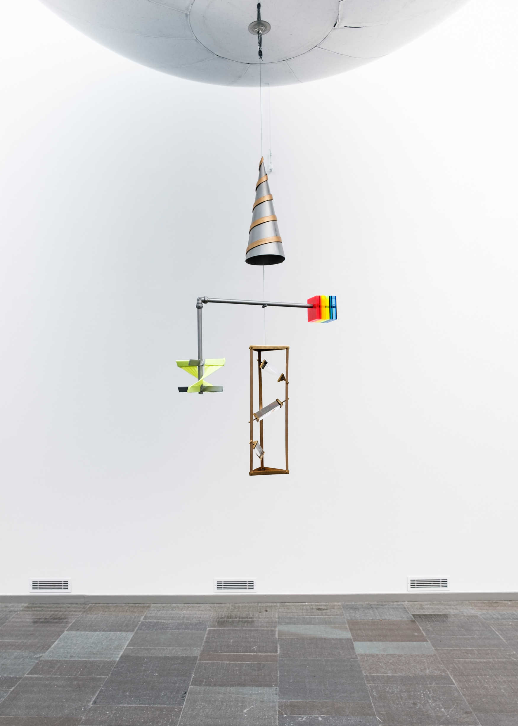 Anna Hoetjes: VEGA 2020  Silver PVC balloon, brass, acrylic, aluminium, prisms, sound 340 × 340 × 550 cm 