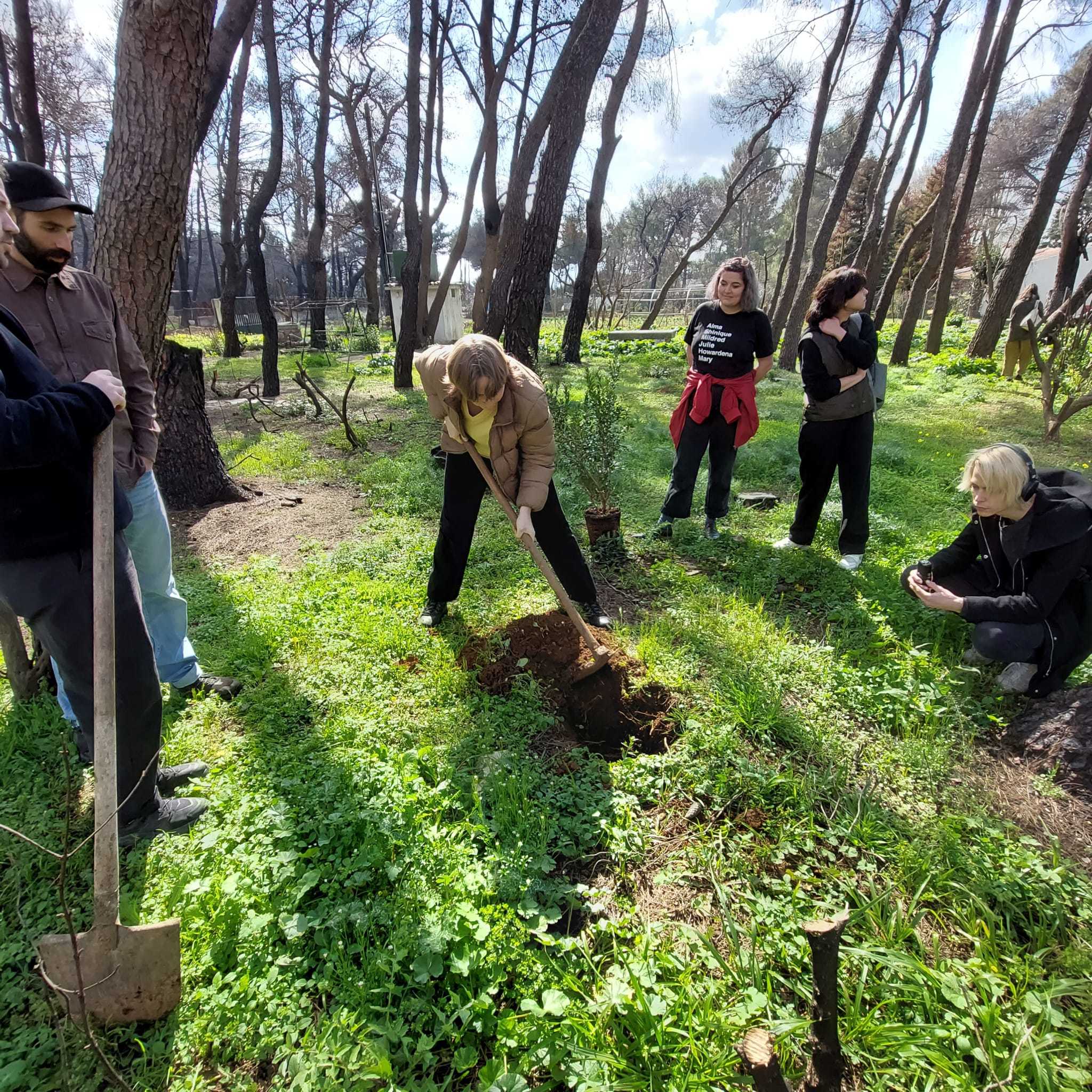Mara Ittel (DAI, 2023) planting & helping out at Stefanos Levidis' burnt summer house estate. COOP study group The Covent of the Care-full in Athens: February 26, 2022. Photo: Nikos Doulos. 