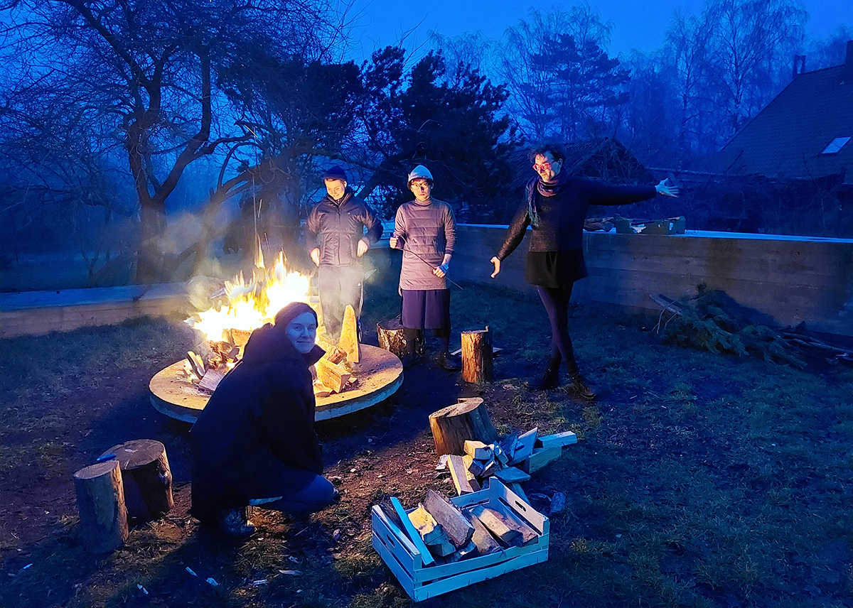 Participants of COOP study group - UNRAVELING THE (UNDER-)DEVELOPMENT COMPLEX on an open fire cooking workshop with chefs Jonas Palekas & Gabija Balčiūnaitė. NAC (Nida Art Colony), Nida. January 2023. Photo credit: Nikos Doulos.