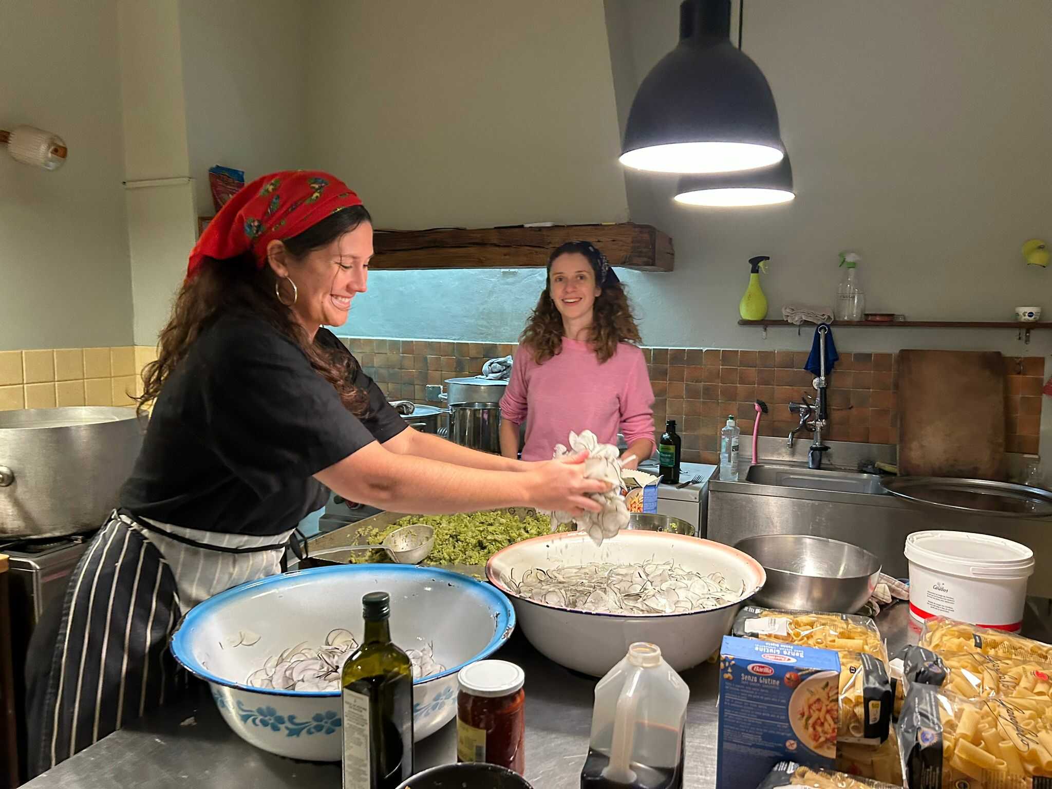 Sophia Braddel & Giulia Tognon in  PAF's cozy kitchen, preparing one of their delicious meals for the DAI family. Photo-credit: Jacq van der Spek. November, 2023.