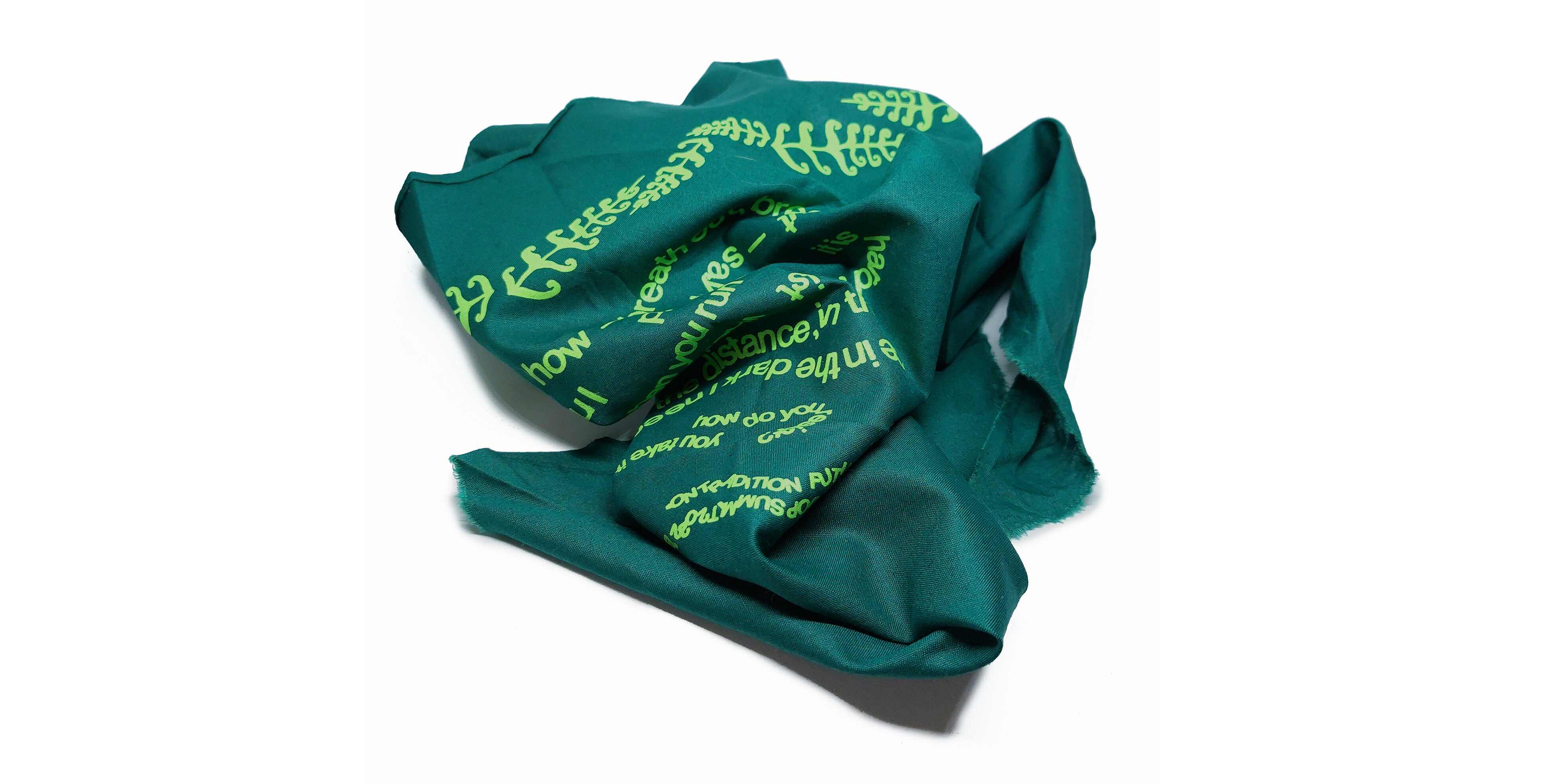 Green triangular bandana (wrapped) designed by COOP study group On Tradition - Future Ancestors 2: Rurality and Law for 2021- 2022 ~ COOP SUMMIT ~ collaborative research presentations in Bergamo & Milan.